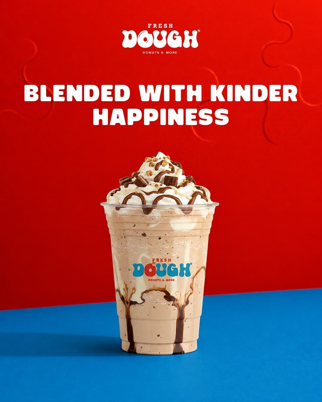 Kinder milkshake topped with cream and chocolate