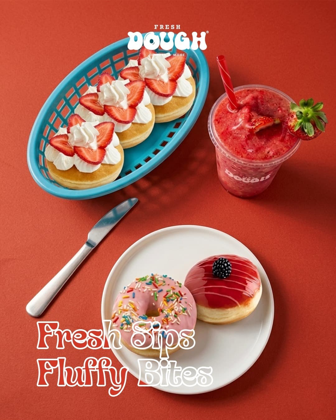 Fresh Dough strawberry donuts and a berry slush on a warm terracotta table